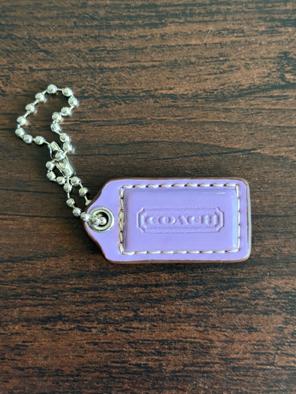 Coach lilac leather hangtag